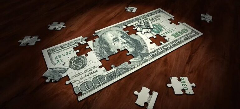 A dollar puzzle on a wooden surface.