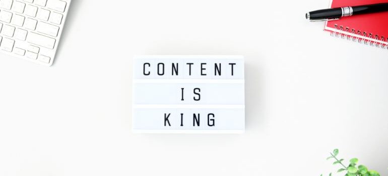 CONTENT IS KING on notepad with white background.