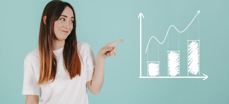 A woman pointing at a chart.