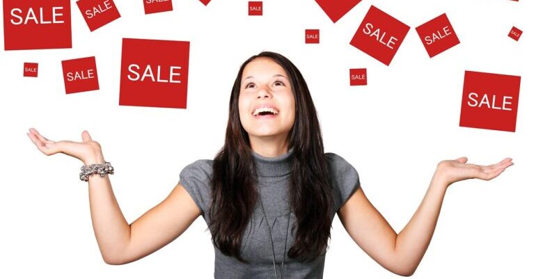 A woman happy because of sale discounts.