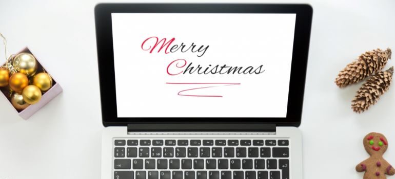 Merry Christmas on laptop screen.