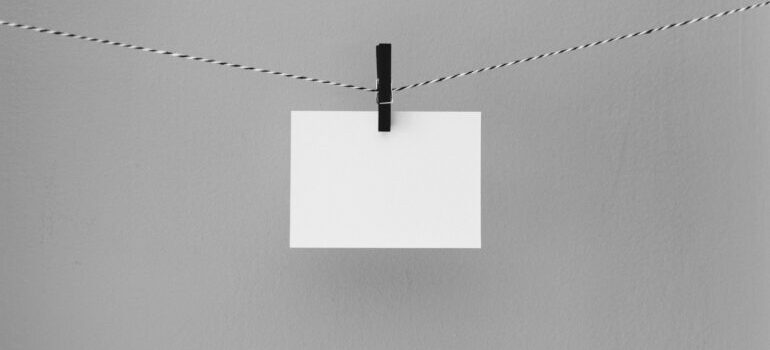 A piece of paper hung on a wire.